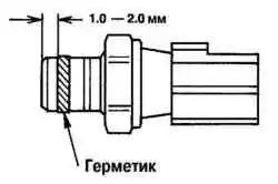 Место нанесения герметика на резьбу датчика давления масла